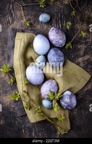 Festive Easter eggs in purple and blue color Stock Photo