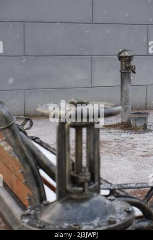 Steampunk-style water pump with valves and pressure gauges. Stock Photo