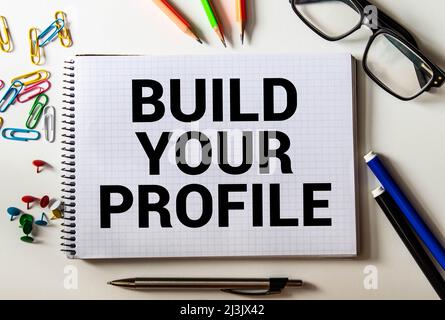 text Build your profile on torn paper, business concept. Stock Photo