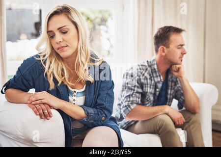 What was said cant be unsaid. Shot of a young couple having relationship problems at home. Stock Photo