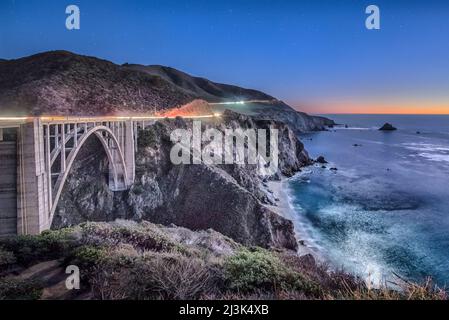 Moonlight illuminating the Bixby Bridge on the California Coast Stock Photo