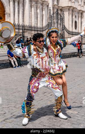 Young People From A Traditional Dance Troupe Perform In The Plaza de Armas (Main Square) Arequipa, Arequipa Region, Peru. Stock Photo