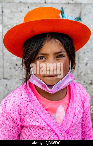 A Portrait Of A Child In The Street (Part Of A Family Group Selling Snacks and Honey), Arequipa, Arequipa Region, Peru. Stock Photo