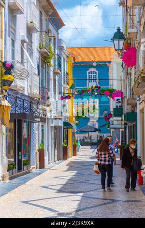 Setubal, Portugal, June 21, 2021: Narrow street of the old town at Portuguese town Setubal. Stock Photo