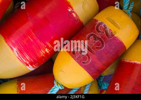 Closeup of colorful, vibrant red and yellow floats for crab pots Stock Photo