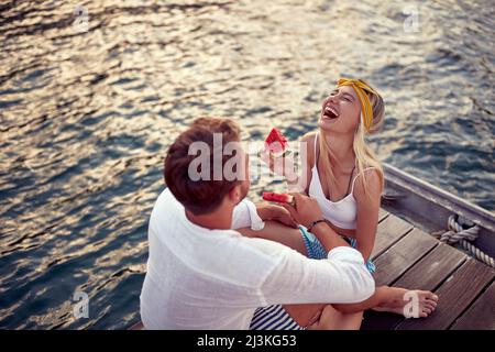 Romantic smiling  couple enjoys by the lake. Beautiful summer day Stock Photo