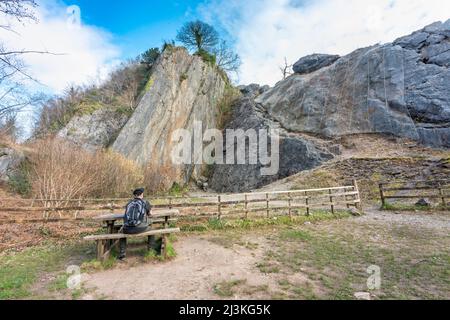 Seating area,near the large impressive high limestone rock and cliff promontory,impressive South Wales landmark,used by rock climbers,on the Sychryd w Stock Photo