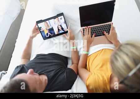 Man and woman remotely communicate with business partners Stock Photo