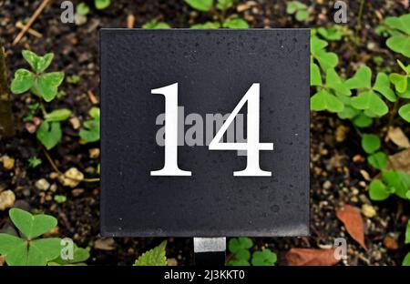 Number 14 printed on metallic plate Stock Photo