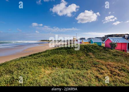 Colourful changing houses and lifeguarding station on Dolphin Beach at Jeffery's Bay on the Eastern Cape of South Africa Stock Photo
