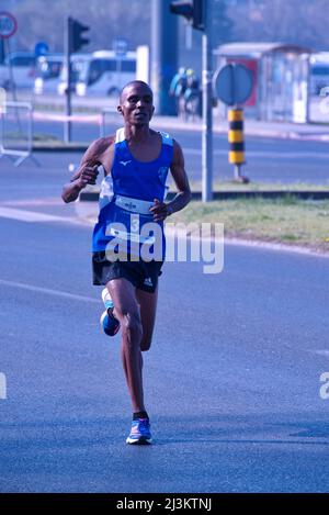 Young African man running marathon race Stock Photo