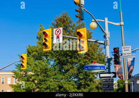 Traffic signs and traffic lights at an intersection; Ottawa, Ontario, Canada Stock Photo