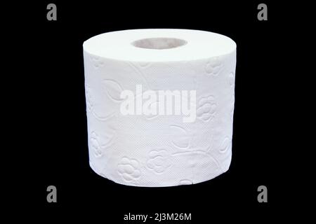 Toilet paper roll on a black background. Presentation of toilet paper roll, isolated on black background. Stock Photo