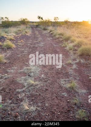 Sunset by a dirt track in the Kimberley, Western Australia Stock Photo