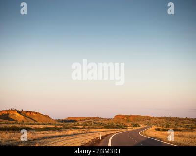 Sunrise on the Great Northern Highway near the Ngumpan Cliffs, Kimberley Stock Photo