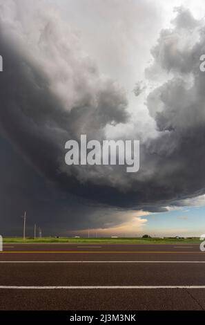 Supercell thunderstorm looms overhead somewhere over the West Kansas prairie; Kansas, United States of America Stock Photo