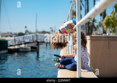 Child boy engaged in fishing hobbies, holds a fishing rod. Summer children  lifestyle. Kids fishing on weekend, copy space Stock Photo - Alamy