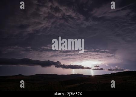 Lightning strikes from a passing supercell thunderstorm in Saskatchewan; Val Marie, Saskatchewan, Canada Stock Photo