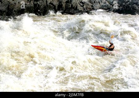 Whitewater kayaker in big rapids on the Potomac River.; Potomac River, Maryland. Stock Photo