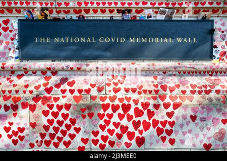 London, UK - 26 March 2022: Detail of the National Covid Memorial Wall, Southbank. Hand drawn hearts with messages and photos of loved ones lost to co