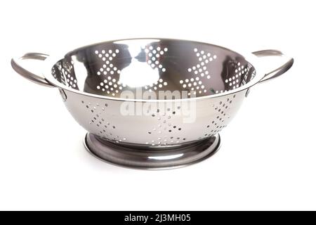 metal colander with handles and stand on a white isolated background Stock Photo