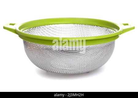 aluminum colander with plastic light green handles on a white isolated background Stock Photo