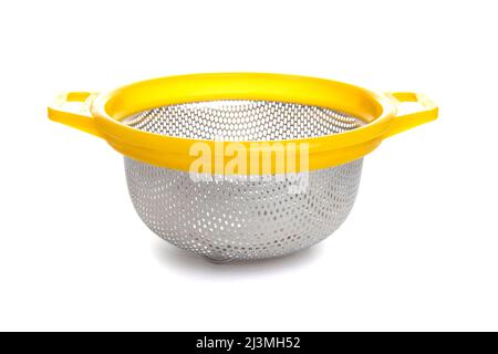 aluminum kitchen colander with plastic yellow handle isolated on white background Stock Photo
