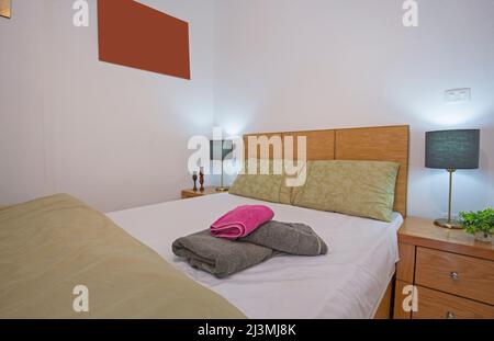 Interior design decor showing modern bedroom area in open plan luxury studio apartment showroom Stock Photo