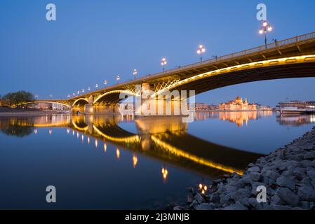Margaret bridge in Budapest reflecting in still water at night Stock Photo