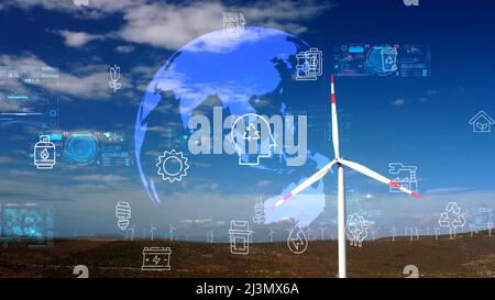 Aerial view over the farm landscape and wind turbines generating clean renewable energy. Renewable energy production for the green ecological world. Stock Photo