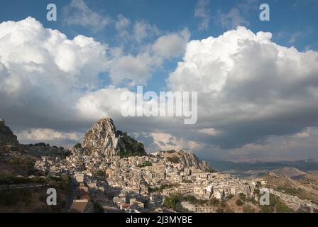 rock of Caltabellotta village in Sicily, in the background dramatic sky with big clouds