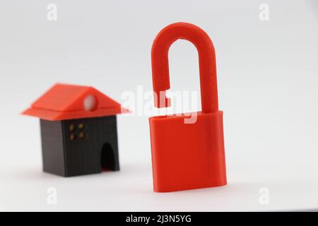 Padlock and small home are 3D printed objects that show the concept of home safety, Mortage and finance concept Stock Photo