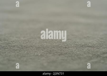 closeup shot of green premium cotton fabric, shallow focus Stock Photo