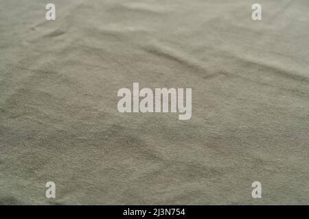 closeup shot of green premium cotton fabric, shallow focus Stock Photo