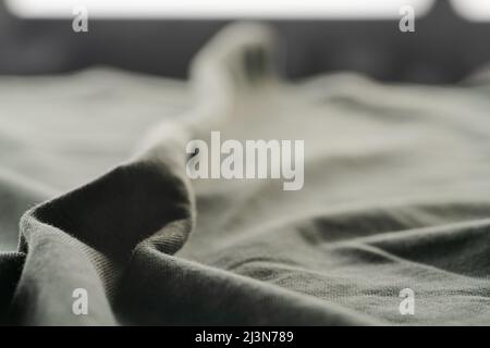 closeup shot of green premium cotton fabric, shallow focus Stock Photo