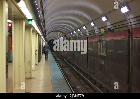 A typical man walking down Chicago’s downtown subway public train station. Stock Photo