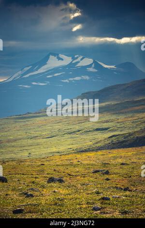 View over Mount Akka from Kings trail snow on the top and storm comming, Gällivare county, Swedish Lapland, Sweden Stock Photo