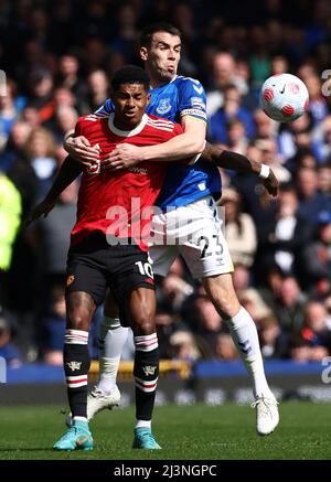 Marcus Rashford of Manchester United challenges Issa Diop of West Ham ...