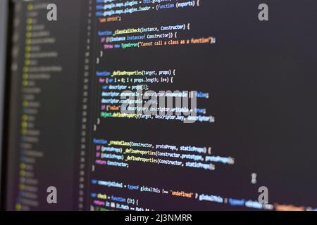 Technology development with javascript code on computer screen. Can be used for background Stock Photo