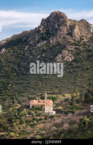 The Couvent de Corbara, the ancient convent outside the village of Corbara in the Balagne region of Corsica with Cima di Sant'Angelo behind Stock Photo