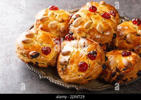 Authentic Yorkshire Fat Rascals scones with dried fruits and almonds close-up in a plate on the table. horizontal