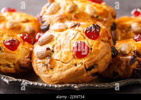 English Fat Rascals scones with dried fruits and almonds close-up in a plate on the table. horizontal