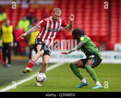 Sheffield, UK. 9th April 2022.  Oli McBurnie of Sheffield Utd and Jordan Zemura of Bournemouth  during the Sky Bet Championship match at Bramall Lane, Sheffield. Picture credit should read: Simon Bellis / Sportimage Credit: Sportimage/Alamy Live News Stock Photo