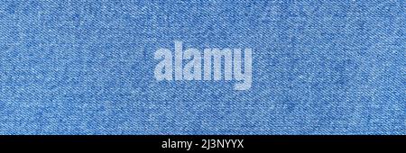 Blue jeans background close up. Top View. Blank Jeans Backdrop or Banner. Empty Simple Cloth Design. Trendy Banner. Long banner. Stock Photo
