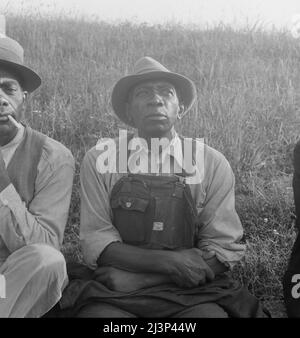 Colored laborers in Memphis, waiting at daylight in hopes of being transported to a cotton plantation for cotton chopping. Memphis, Tennessee. Stock Photo