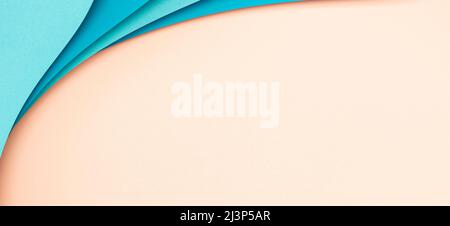 Abstract color papers geometry flat lay composition background with blue color curved lines and shapes on pink background Stock Photo