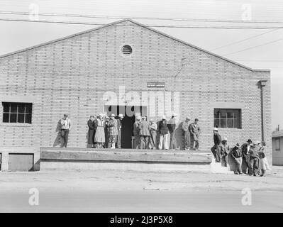 Warehouse, used as distributing office for Farm Security Administration (FSA) relief grants of commodities to destitute farm labor families during cotton strike of October 1938. Bakersfield, California. Stock Photo