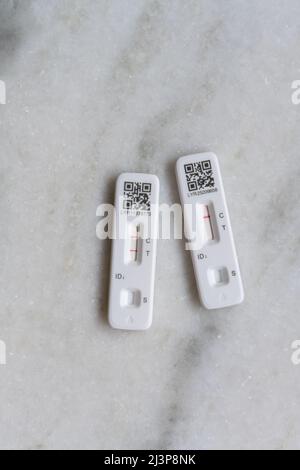 Self- or home-administered rapid lateral flow tests (LFT) for COVID-19 Coronavirus, both positive and negative Stock Photo
