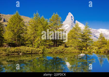 Great  panorama with famous peak Matterhorn in alpine valley. Popular tourist attraction. Dramatic and picturesque scene. Location place Swiss alps, G Stock Photo