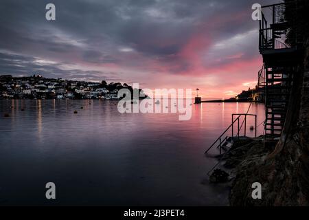 Polruan sunset, a fishing village on the Fowey River, Cornwall, United Kingdom at  dusk Stock Photo